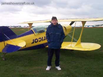 About me - Me next to an aerobatic Pitts airplane, on a trial aerobatics lesson run by Alan Cassidy (competition winning aerobatics pilothttp://www.worldaerobatics.com/) (submitted by James Rowson).