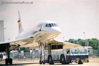 About me - Concorde G-BOAG being taxiied behind the BA engineering workshops at London Heathrow Airport (James Rowson).