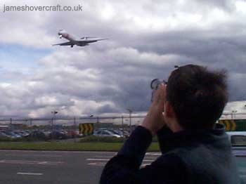 About me - Me taking video of a MD-87 SAS airplane coming into land at Heathrow Airport, 2001 (submitted by James Rowson).