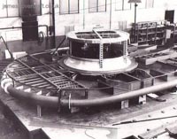 The SRN1 being manufactured - The shell of the SRN1 during construction. The engine mount and main intake is clearly visible as is the inner shell of the plenum chamber. The top criss-cross of beams is the start of the outer layer of the plenum which, when reaching the edges of the craft, deflected the air downwards creating the famous air cushion effect by Momentum Curtain (submitted by Peter Insole).